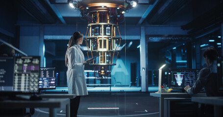 Female Computer Scientist Developing Quantum Machine Learning Algorithms, Using a Tablet Computer...