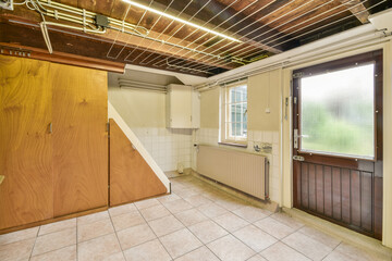 A clean, modern room featuring wooden elements, a large window, and neutral-colored walls. Ideal for minimalistic design and functionality.