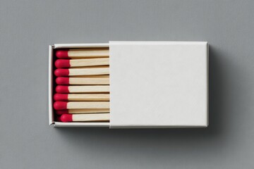 mock-up of a white, empty matchbox with red wooden matches on a grey background