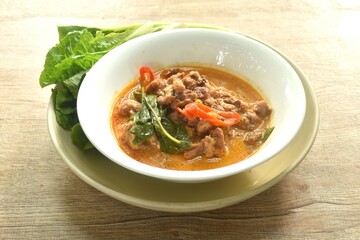 spicy boiled beef meat with eggplant in coconut milk red curry soup on bowl eat couple fresh cos vegetable