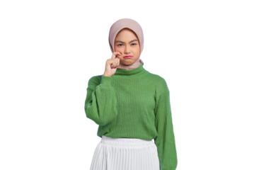 Beautiful young Asian woman in green sweater rubs tears wants to cry feels depressed has a problem isolated on transparent background