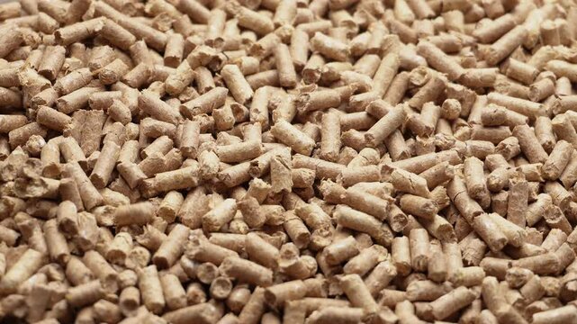 Wood pellets closeup for cat litter, background texture