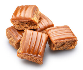 Caramel sweets or butterscotch fudge on white background. File contains clipping path.