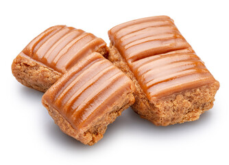 Caramel sweets or butterscotch fudge on white background. File contains clipping path.