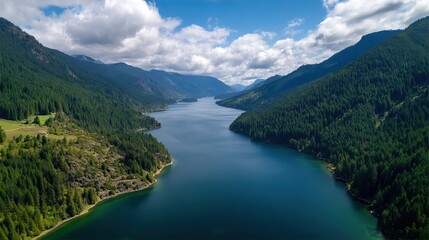 Amazing lake view, surrounded by green hills and forests, blue sky and white clouds, perfect for tourist posters and outdoor activities such as hiking, fishing, camping.