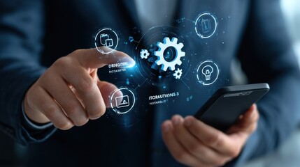 Businessman holding a smartphone and touching a gears icon with a digital hologram of icons on a virtual screen. This represents a technology business concept for information system or marketing plan