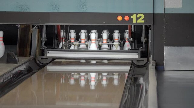 An exhilarating bowling experience with dynamic strikes and spares unfolds at a vibrant, modern alley