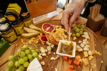 Cheese and fruit platter tasting at a farmers market