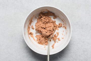Overhead view of nigerian akamu or pap paste, process of making akamu, flatlay of process of making nigerian akamu ogi pap or guinea corn pudding