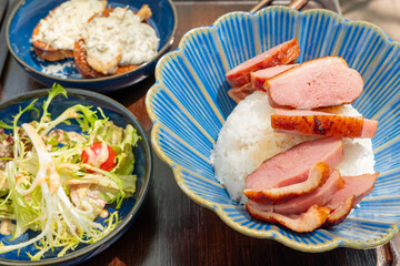 angle view smoked duck breast rice served with salad and bread at horizontal composition