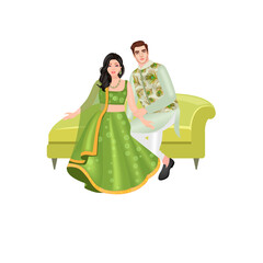 Young Indian Couple Sitting In a Sofa Wearing Green Traditional Outfit 