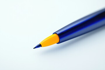 CloseUp of a Blue and Yellow Pen Tip on White Background Ideal for Stationery Writing Tools