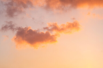 Fluffy Cloud Floating in Pastel Evening Sky Background at During Golden Hour Time.