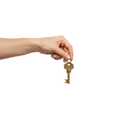 Close-up of a hand holding a key. The hand is fair-skinned, and the key is an antique brass color. The image is isolated on a black background.