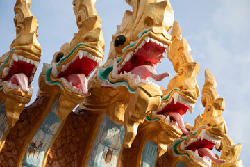 Painted statues of Nagas near Wat Phousalao temple in Pakse, Laos, Champasak