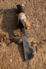 An old machete worn out, but freshly sharpened by an old man, in the Bai Don market in Pakse