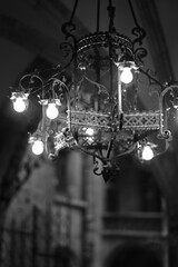 Fragments of historic Gothic architecture illuminated by a vintage lamp