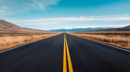 Naklejka premium Expansive Rural Road Winding Through Distant Mountains Evoking Peacefulness and Adventure