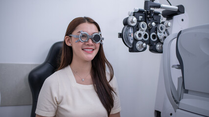 ํYoung woman undergoing eye examination at an optometry clinic optical phoropter moment in vision care, focusing on diagnostic precision, patient comfort, and modern eye health practices.