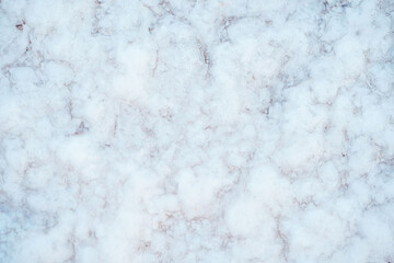 Background with white salt texture. Close-up of the surface of the salt lake. Use for a banner.