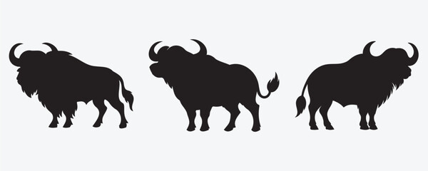 Silhouettes of three powerful buffalo with distinct horns and shaggy bodies, shown in varied poses on a light background