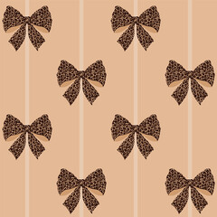 Seamless pattern of leopard print bows and stripes on sand background.