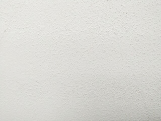 White textured surface. Closeup view, ideal for background use. Offers a subtle, clean backdrop for various design applications. Versatile for overlays and mockups.