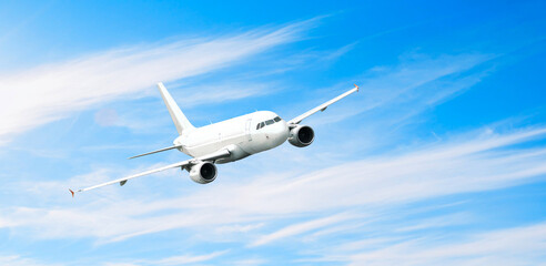 Airplane in the sky, travel background with flying airplane with blank livery, air travel background