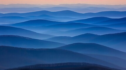 Obraz premium Layers of blue mountains: A serene landscape with misty mountain ridges