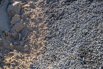 Construction rubble and sand on a sunny day close-up
