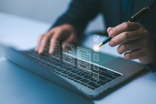 Business performance checklist concept, Businessman using laptop take an assessment, An businessman checklist online survey filling form list options business employee security procedures.