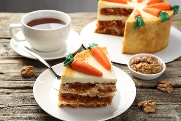 Delicious homemade carrot cake served on wooden table