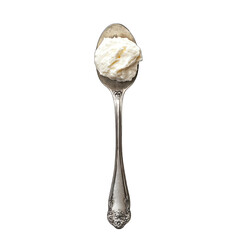Close up of a silver spoon holding a dollop of white cream on black background
