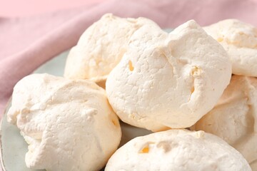 Delicious homemade meringue cookies on table, closeup