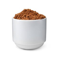 Superfood. Nutmeg powder in bowl isolated on white
