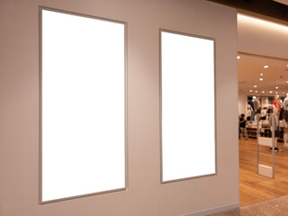 double vertical billboard mockups at fashion store entrance for retail advertising design