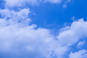 Fluffy Clouds Against a Vibrant Blue Sky