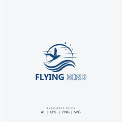 Elegant Blue Flying Bird Silhouette Logo Design Symbolizing Freedom
