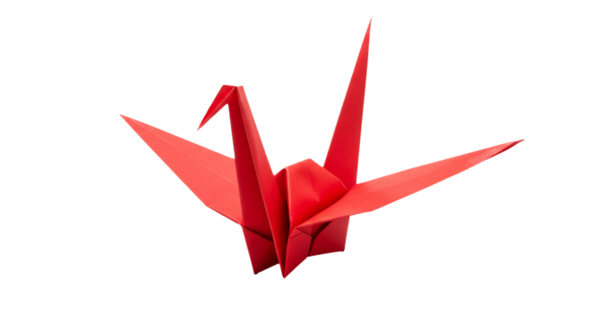 Artistic origami paper crane in vibrant red against pristine white background