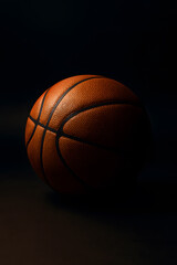 Obraz premium Basketball close up shot on dark background for sports enthusiasts and basketball fans and players alike