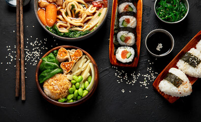 Traditional Japanese food dishes served on the table.