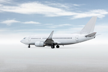 White passenger jetliner isolated on bright background with sky