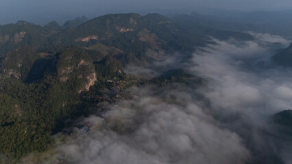 Clouds on high mountain peaks in the rainy season in the Asian rainforest.