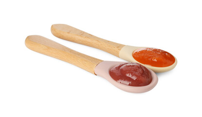 Baby food. Spoons with tasty puree on white background