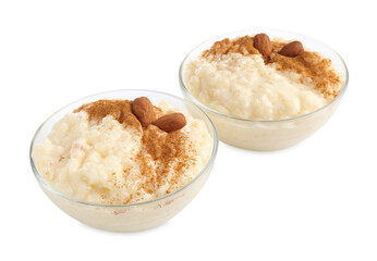 Delicious rice pudding with cinnamon and almonds in glass bowls isolated on white