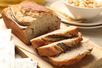 Pieces of banana bread with nuts on table, closeup