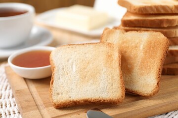 Slices of tasty toasted bread and jam on table, closeup