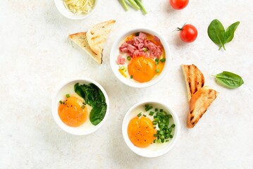 Baked eggs (eggs en cocotte) and toasts for dipping