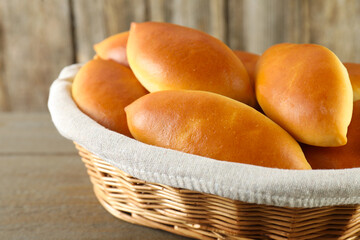 Tasty baked patties on wooden table, closeup