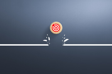 Target icon on wooden cube breaking through obstacle, Concept of overcoming barriers, goal, target